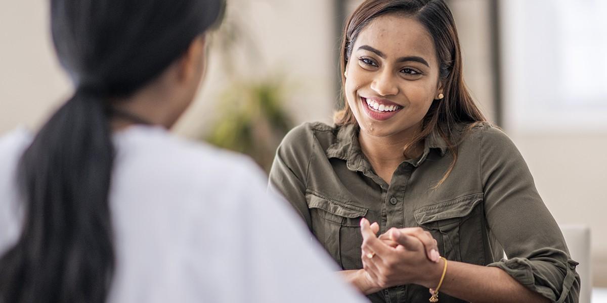 Young Woman Consulting with Public Health Worker